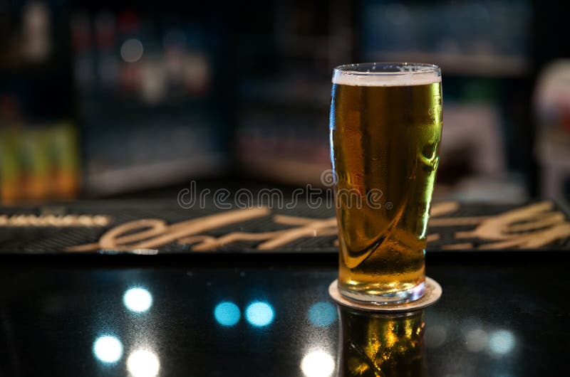 Chilled Beer in the glass stock image. Image of pour 202017067