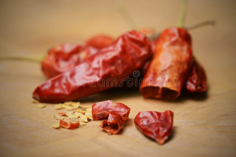 Chilli pods and seeds, sliced on a chopping board