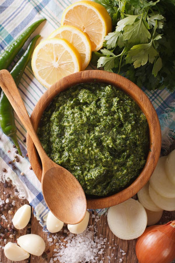 Chimichurri Sauce with Ingredients Closeup. Vertical Top View Stock