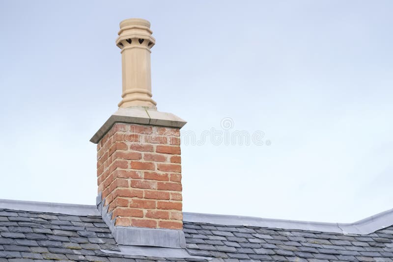 Chimney pot on old victorian house roof building uk