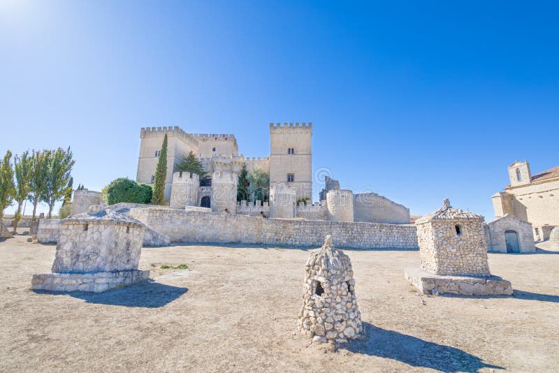 Chimneys on the floor and castle in Ampudia