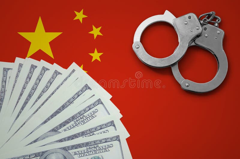 China flag with handcuffs and a bundle of dollars. The concept of illegal banking operations in US currency