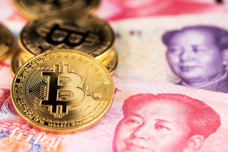 China Yuan Banknotes And Bitcoin Cryptocurrency Coins.