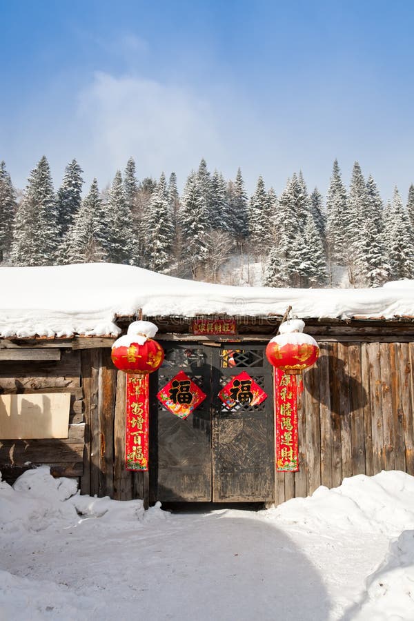 Rural house with red lantern and couplet on the door in traditional Chinese new year. Rural house with red lantern and couplet on the door in traditional Chinese new year.