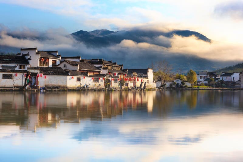 Chinese ancient village - Hongcun in mist stock photo Chinese ancient village - Hongcun in mist stock photo