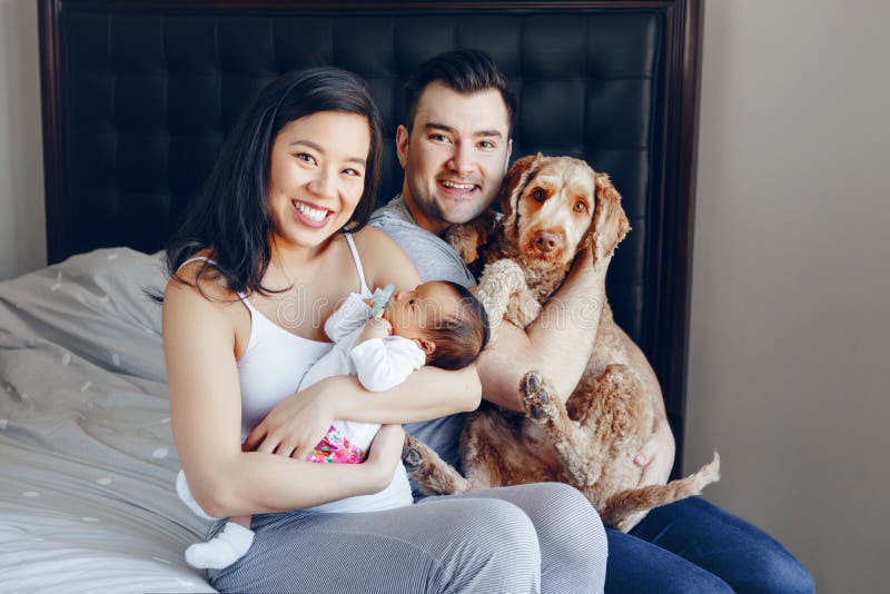 Chinese Asian Mother and Caucasian Father with Mixed Race Newborn Infant Baby Stock Photo photo