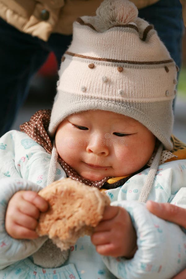 Chinese Baby Eating Bread Stock Photography Image 7884412
