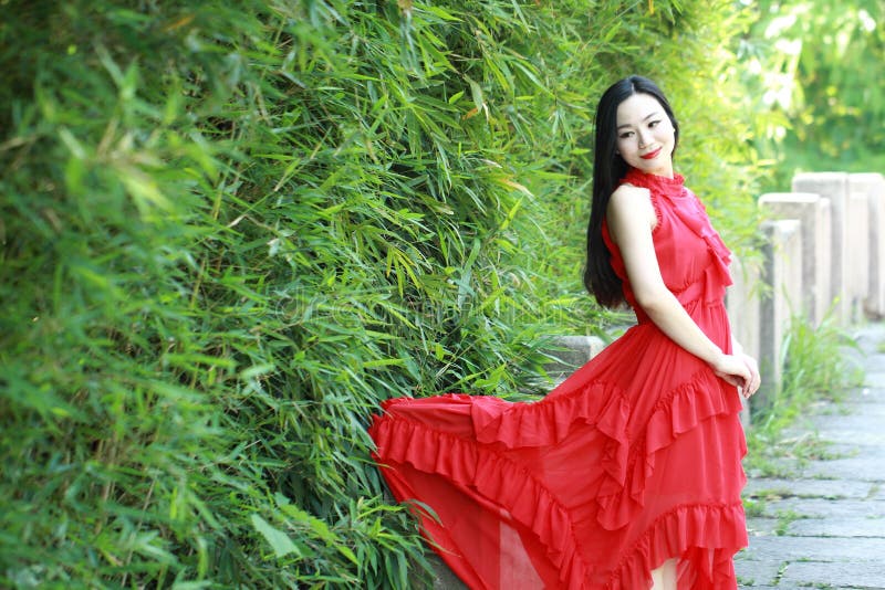 Chinese beauty sit on an ancient bridge enjoy vacation stock image Chinese beauty sit on an ancient bridge enjoy vacation stock image