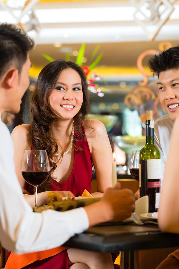 Chinese business people dining in elegant restaurant royalty free stock photo Chinese business people dining in elegant restaurant royalty free stock photo