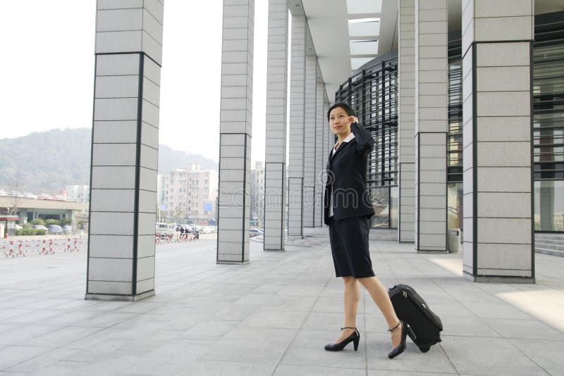 Chinese business women with suitcase