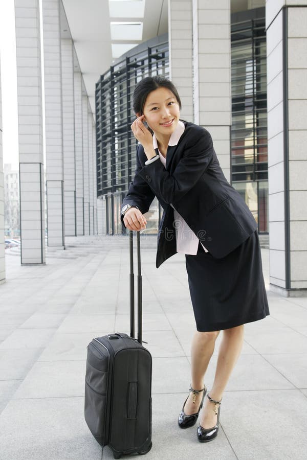 Chinese Business Women With Suitcase Picture. Image 5121264