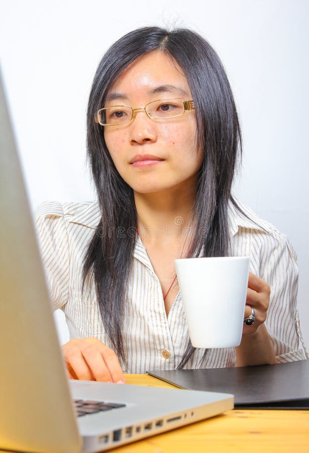 Chinese businesswoman drinking coffee