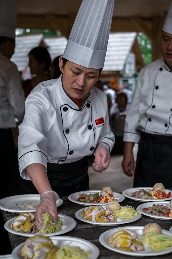 Chinese Cook Arranges Food O