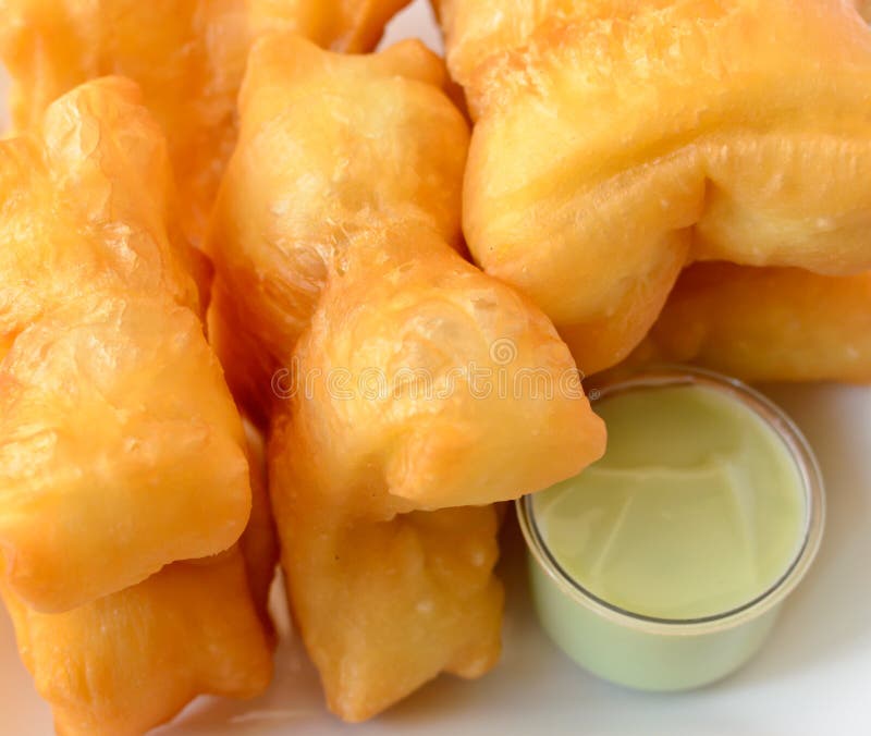 Chinese Deep Fried Dough in Hot Oil on Steel Pan. Youtiao, Padnoongo or