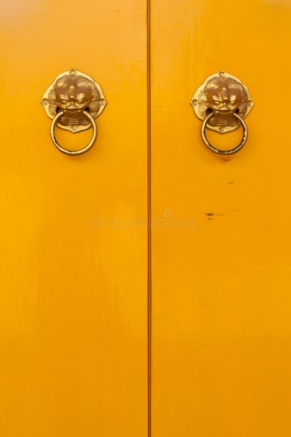 Chinese door handles on yellow doors vertical