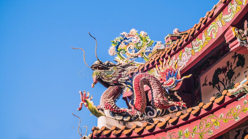 Chinese dragon on the roof of chinese temple.the eaves of a temple in China Dragons on the roof of Heaven Worshiping Palace . stock photo Chinese dragon on the roof of chinese temple.the eaves of a temple in China Dragons on the roof of Heaven Worshiping Palace . stock photo