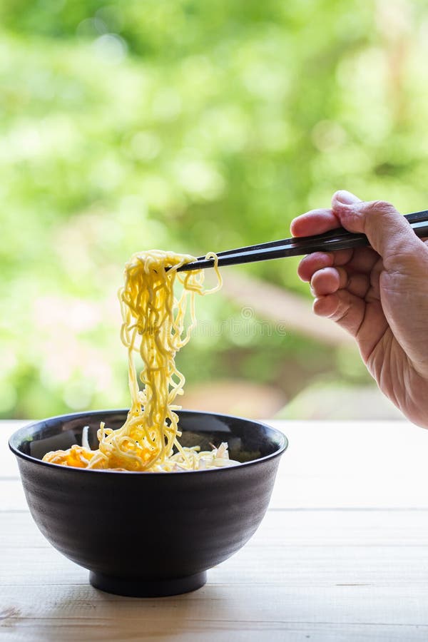 Chinese Egg Noodles with Hand Hold Chopsticks Stock Image Image of hand, bowl 77012289