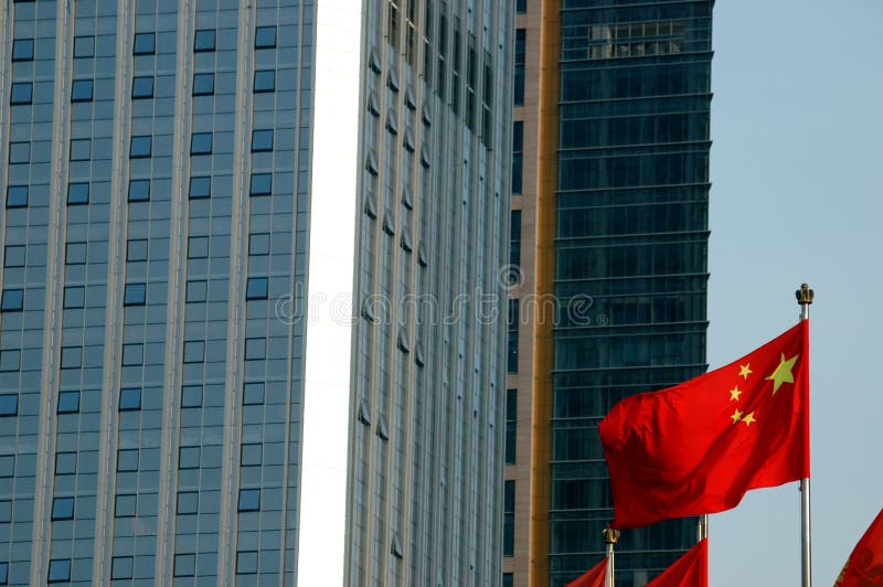 Chinese flag and modern buildings - closeup