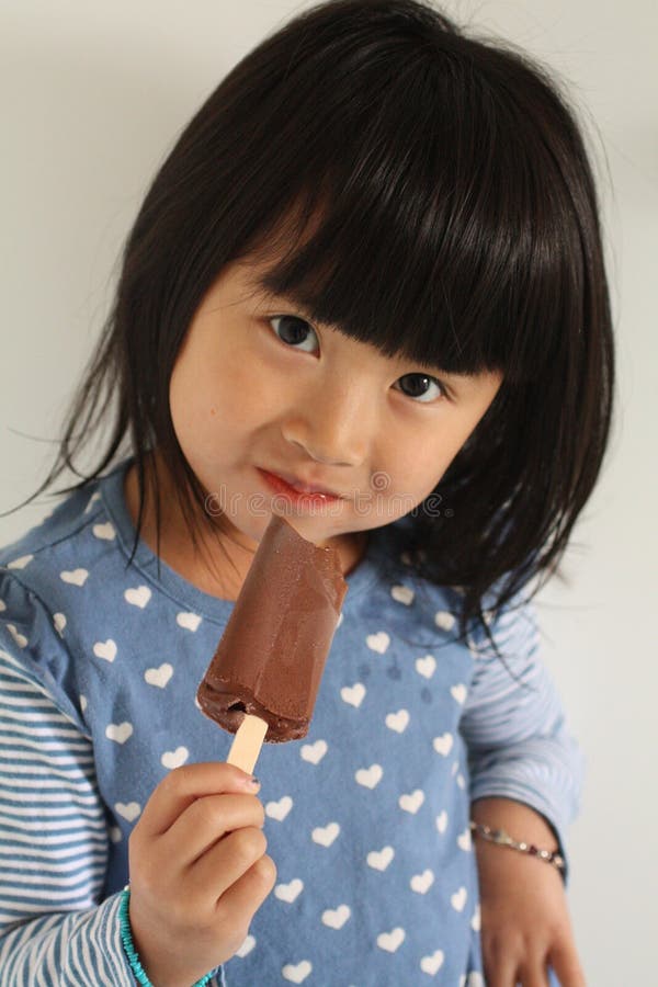 Chinese Girl Eating Ice Pop