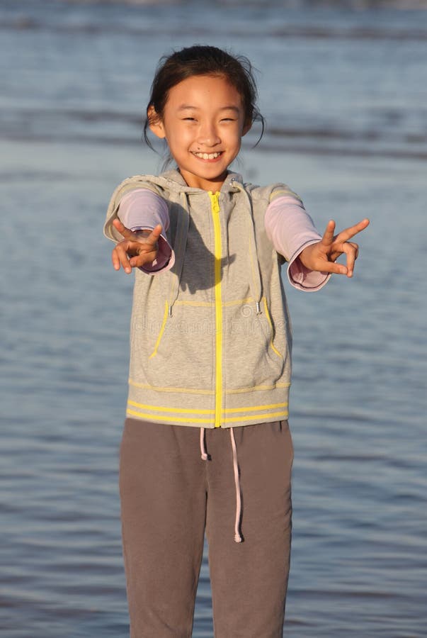 Chinese Girl with Victory Hand Signal Stock Image - Image of victory ...