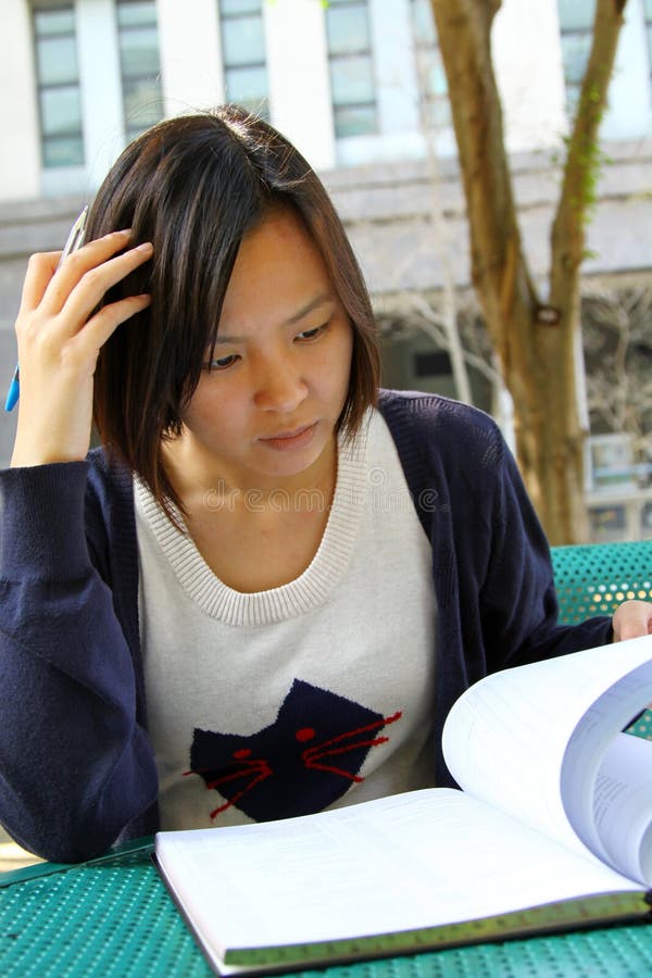 Chinese girl who is reading books