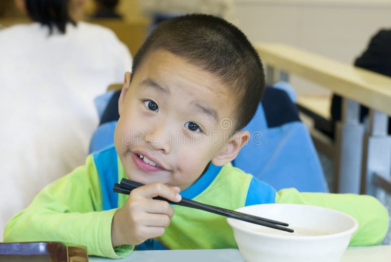 A Chinese kid have breakfast