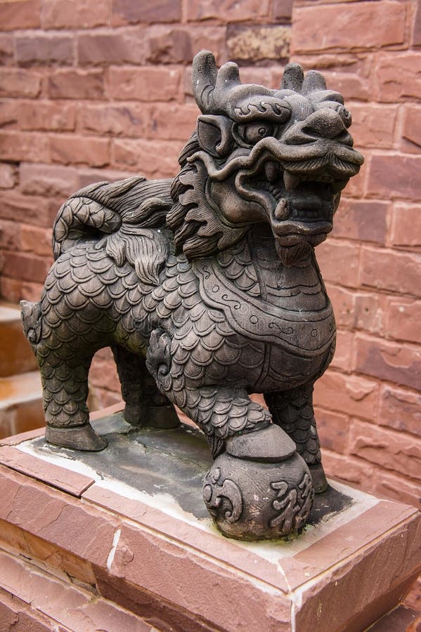 Golden Chinese lion statue stock image. Image of ball 33027833