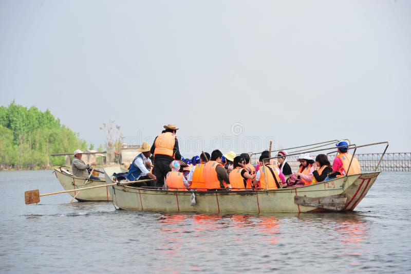 Chinese man fishing with cormorants birds stock photos Chinese man fishing with cormorants birds stock photos