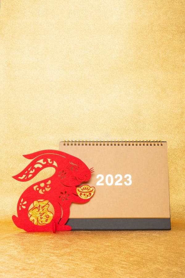 Chinese New Year of Rabbit Mascot with 2023 Calendar on Golden