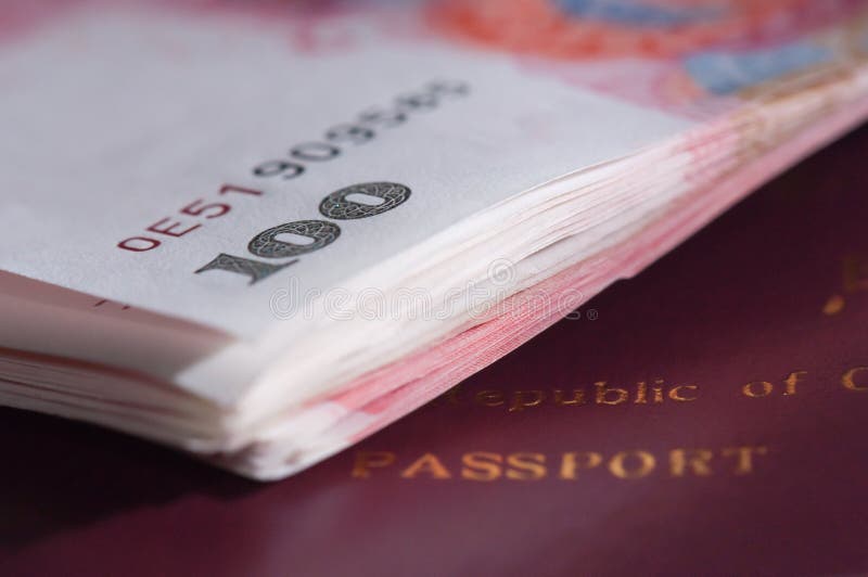 Chinese passport and currency stock photo Chinese passport and currency stock photo