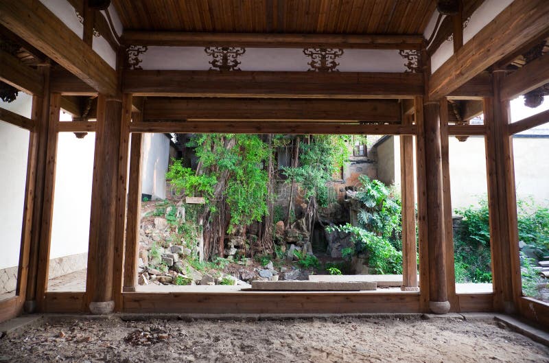 Chinese style backyard viewed from a old empty house. This backyard and house are a typical architectural style of the Ming and Qing Dynasties in southeast China. Pillar column garden stock images, royalty-free photos and pictures