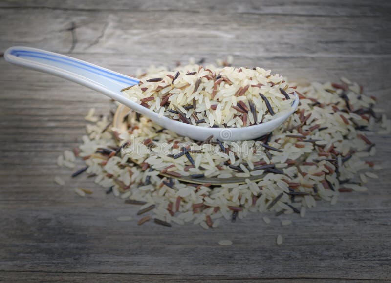 Chinese Traditional Spoon, Rice on the Old Wooden Table Stock Image