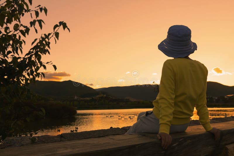 Chinese woman enjoying sunset royalty free stock photo Chinese woman enjoying sunset royalty free stock photo