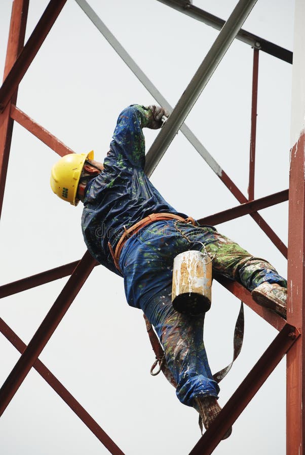 Chinese worker painting steel structure