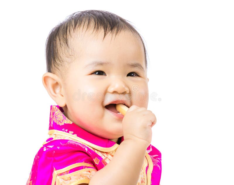 Chinesisches Baby, das Keks isst stockfotografie Chinesisches Baby, das Keks isst stockfotografie