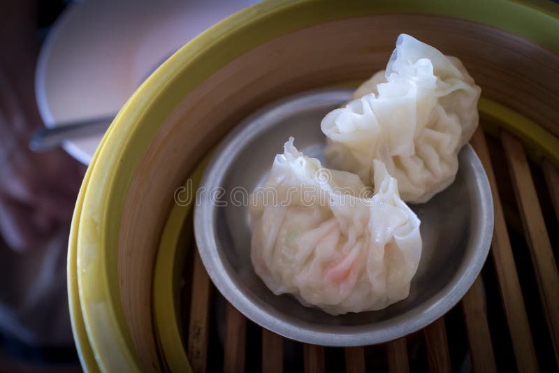 Chinese Dim Sum (Steamed Chinese Dumpling) on bamboo tray or Shumai. Chinese Dim Sum (Steamed Chinese Dumpling) on bamboo tray or Shumai