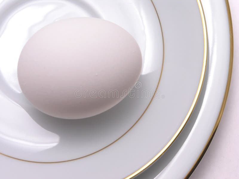 Egg on fine china saucer and plate. Egg on fine china saucer and plate