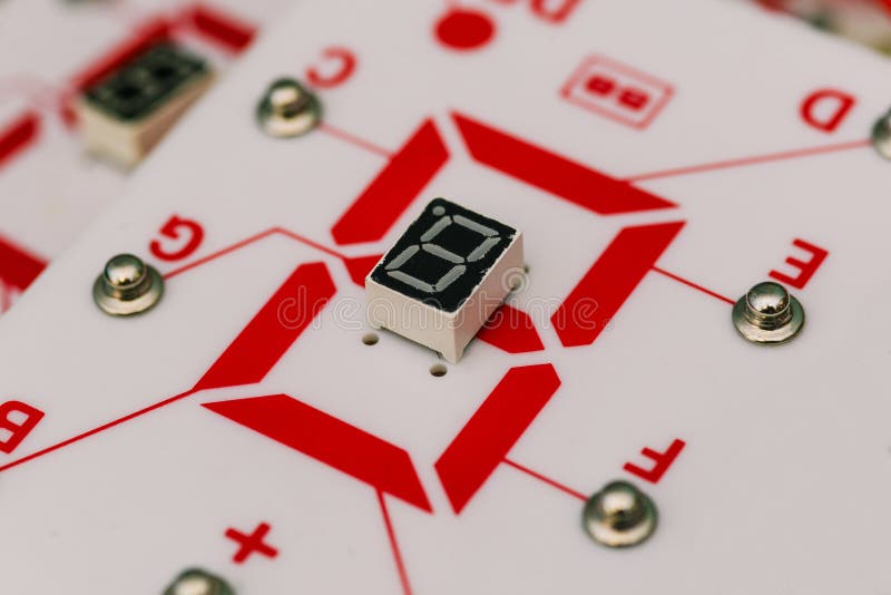Chip with a digital LED indicator. Seven-segment indicator. Electronic constructor. Display device for digital information. The royalty free stock photos