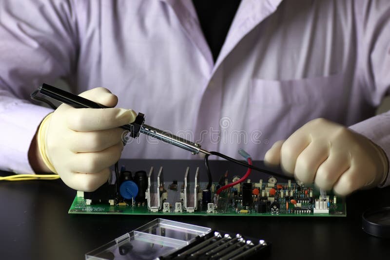 Chip soldering man hands stock image. Image of equipment 79132471