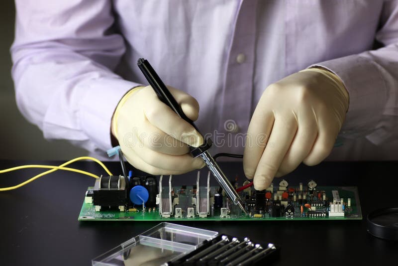 Chip soldering man hands stock image. Image of cable 89483799