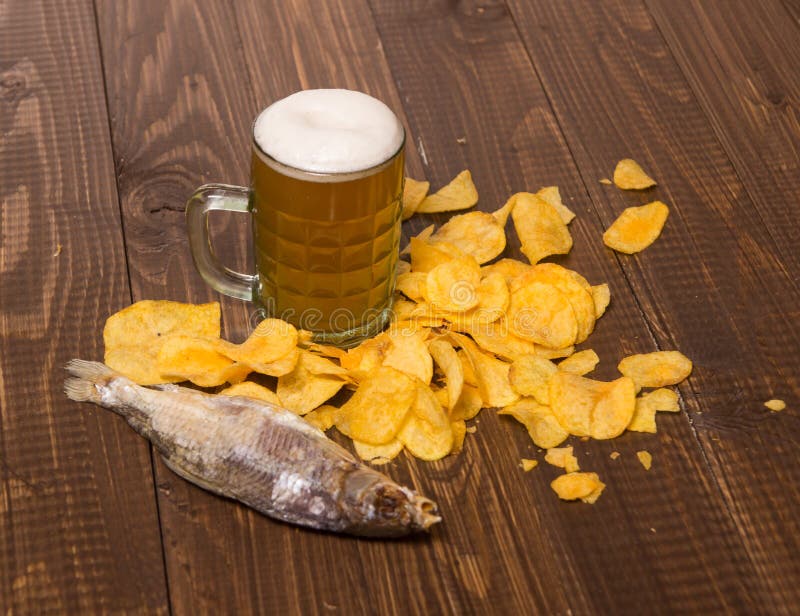 Chips with beer and fish stock image. Image of frothy 67747585