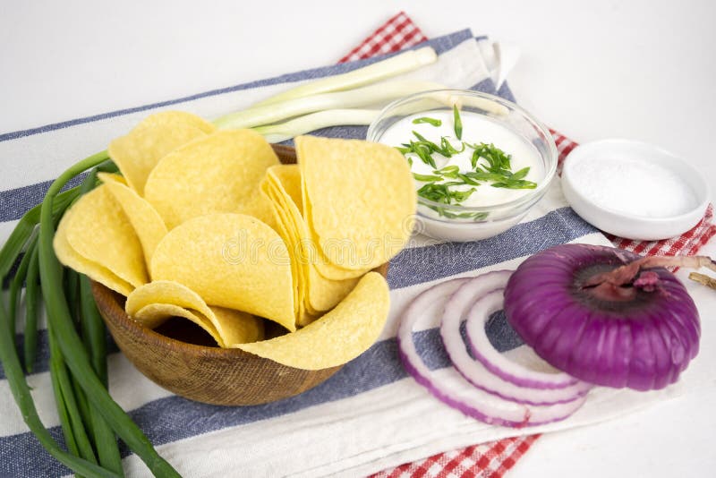 Chips in a Wooden Bowl with Sour Cream and Green Onion Stock Photo