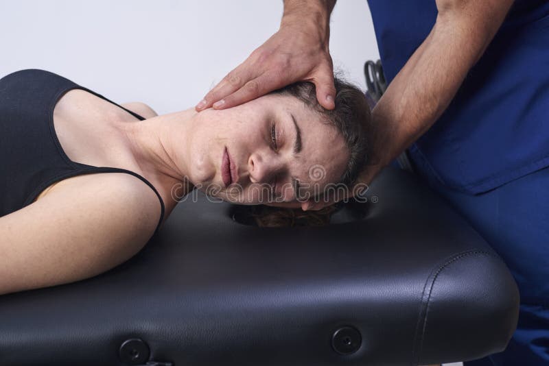 Chiropractic getting mobilization cervical spine of a woman. Manual therapy. Neurological physical examination. Osteopathy