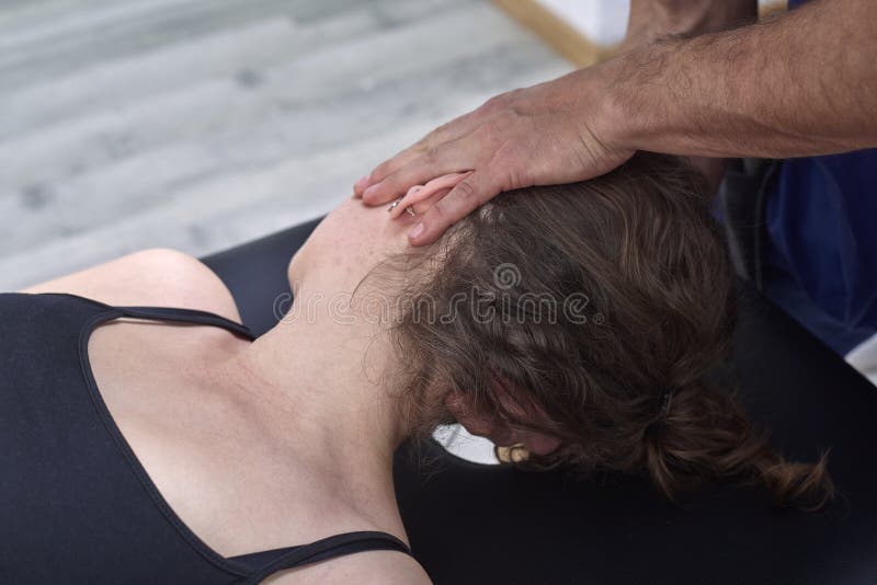 Chiropractic getting mobilization cervical spine of a woman. Manual therapy. Neurological physical examination. Osteopathy