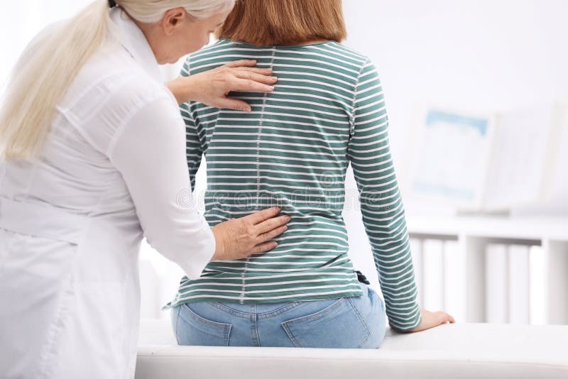 Chiropractor Examining Patient with Back Pain Stock Photo Image of
