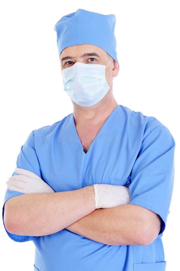 Chirurgo maschio maturo con la mascherina ed i guanti medici immagine stock