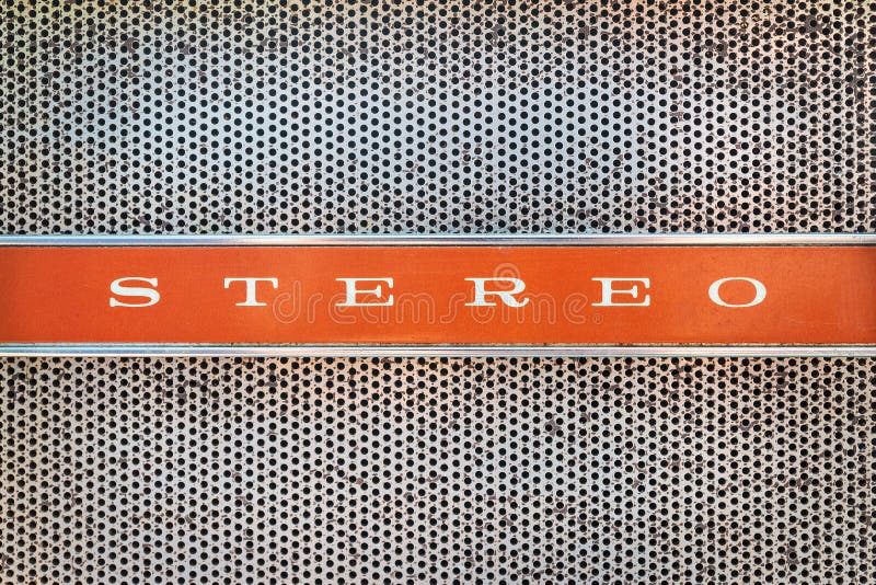 Close up of a vintage jukebox with the text stereo on an orange background. Close up of a vintage jukebox with the text stereo on an orange background