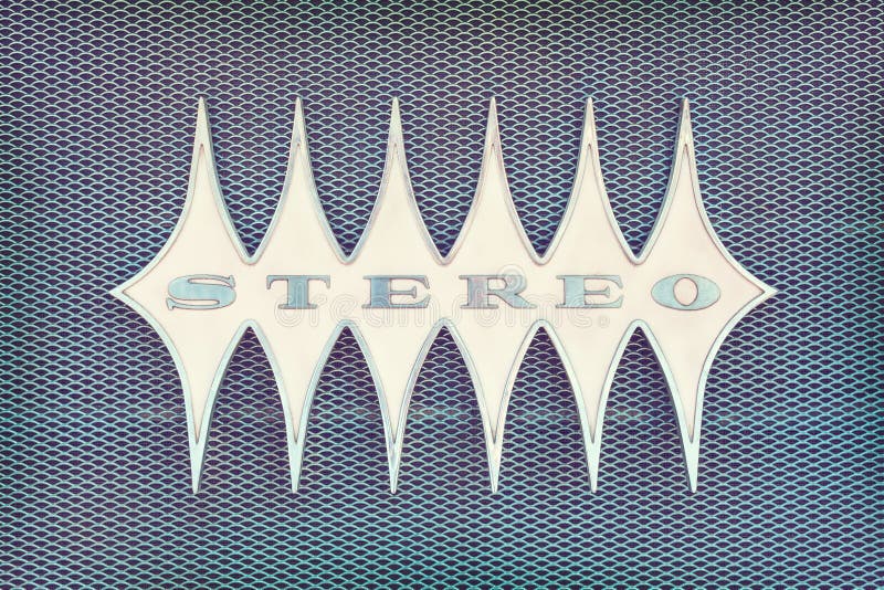 Close up of a vintage jukebox with the text stereo in metal. Close up of a vintage jukebox with the text stereo in metal