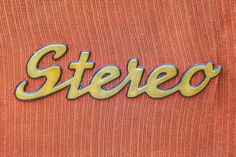 Close up of a vintage jukebox with the text stereo in gold color. Close up of a vintage jukebox with the text stereo in gold color