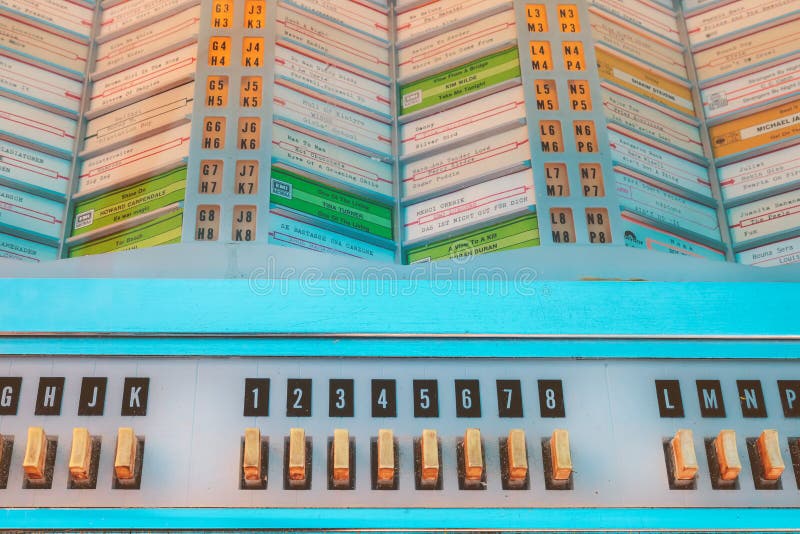 DEN BOSCH, THE NETHERLANDS - MAY 14, 2017: Close up of a vintage jukebox on an antique fifties to seventies flea market in Den Bosch, The Netherlands. DEN BOSCH, THE NETHERLANDS - MAY 14, 2017: Close up of a vintage jukebox on an antique fifties to seventies flea market in Den Bosch, The Netherlands